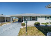 Charming single-story home with carport and well-maintained landscaping at 709 W Brockton Pl, Sun City Center, FL 33573