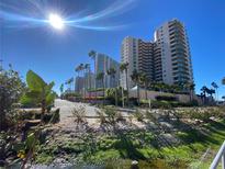 Coastal condo community with palm trees and waterfront access at 1540 Gulf Blvd # 2107, Clearwater Beach, FL 33767