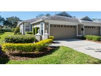 Attractive single-story home with two-car garage and well-manicured landscaping at 5733 Heronpark Pl, Lithia, FL 33547