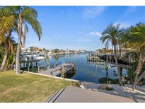 Private dock with boat slips, offering convenient water access at 475 Island Way, Clearwater Beach, FL 33767