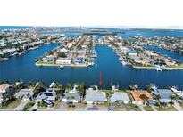 Aerial view of waterfront home with private dock and boat access at 440 115Th Ave, Treasure Island, FL 33706