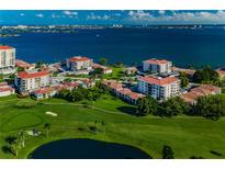 Aerial view of waterfront community with lush landscaping and golf course at 6180 Sun Blvd # 204, St Petersburg, FL 33715