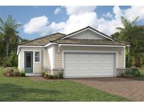 Single-story home with a two-car garage and attractive landscaping at 11188 Livewell Ct, Venice, FL 34293