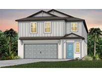 Two-story house with gray siding, a two-car garage, and a light blue front door at 9803 Crescent Moon Dr, Riverview, FL 33578