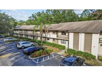 Condo building with ample parking and landscaping at 3034 Eastland Blvd # D108, Clearwater, FL 33761
