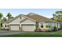 Two-car garage, gray exterior, and landscaping at 731 157Th E Ct, Bradenton, FL 34212