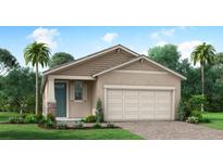 One-story home with tan siding, teal door, and two-car garage at 12260 Meditation Trl, Venice, FL 34293