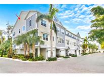 New construction townhomes featuring two-car garages, and beautiful tropical landscaping at 3132 Nautical S Pl, St Petersburg, FL 33712