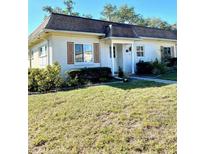 Charming single-story home with a well-maintained lawn and landscaping at 1660 S Lake Ave # 1, Clearwater, FL 33756