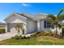 Charming single-story home featuring a well-manicured lawn and neutral-toned exterior at 17901 Solstice Ave, Venice, FL 34293