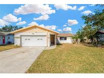 Ranch style home with a large yard and attached garage at 2414 16Th W St, Palmetto, FL 34221