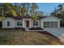 Single-story house with red tile roof, attached garage, and manicured lawn at 9800 Mendel Dr, New Port Richey, FL 34654