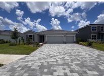 Charming single-story home featuring a two-car garage and a patterned brick driveway at 4315 Pullet Ct, Lakewood Ranch, FL 34211