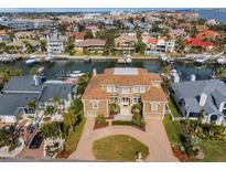 Luxury waterfront home with circular driveway, and private boat dock at 119 8Th E St, Tierra Verde, FL 33715