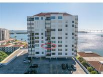 White condo building featuring balconies and water views at 6287 Bahia Del Mar Cir # 603, St Petersburg, FL 33715
