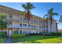 Two-story building with balconies and palm trees at 5150 10Th N Ave # 111, St Petersburg, FL 33710