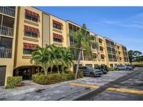 Building exterior showcasing landscaping, parking, and building features at 5817 Park N St # 204, St Petersburg, FL 33709