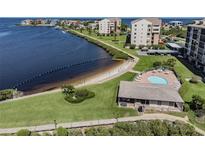 Aerial view of waterfront community with pool and beach access at 4650 Bay Blvd # 1046, Port Richey, FL 34668