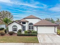 Single-story home with a two-car garage and well-manicured lawn at 1515 Lions Club Dr, Brandon, FL 33511