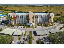 Aerial view of a condominium complex with parking and lush landscaping at 2320 Terra Ceia Bay Blvd # 403, Palmetto, FL 34221