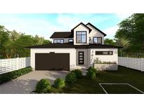 Two-story house with a modern farmhouse design, featuring a dark brown garage door and white siding at 307 W West St, Tampa, FL 33602