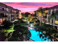 Beautiful condo community with a refreshing pool and lush landscaping at 3035 Countryside Blvd # 30B, Clearwater, FL 33761