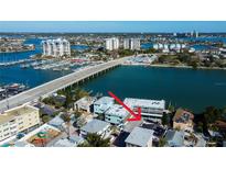 Aerial view showcasing home's waterfront location and surrounding neighborhood at 141 94Th Ave, Treasure Island, FL 33706