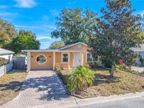 Cute bungalow style home with brick driveway and well-manicured lawn at 4202 Las Vegas Dr, New Port Richey, FL 34653