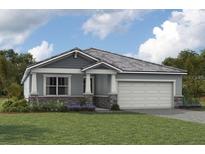 One-story home with gray siding, stone accents, and a two-car garage at 11570 Myakka Blue Dr, Venice, FL 34293