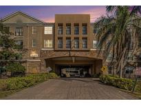 Building exterior featuring a grand entrance and landscaping at 4221 W Spruce St # 2418, Tampa, FL 33607