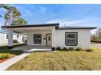 Newly renovated house with a modern facade and a covered porch at 1246 Upton S Ct, St Petersburg, FL 33712