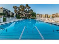 Enjoy the large pool with ample seating and sundeck in this lovely condo community at 14130 Rosemary Ln # 4311, Largo, FL 33774