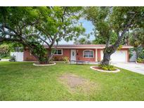 Charming single-story home with landscaped front yard and attached garage at 4600 16Th N St, St Petersburg, FL 33703