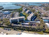 Aerial view of waterfront condo community with pool and parking at 1316 Pasadena S Ave # 203, South Pasadena, FL 33707