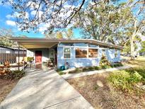 Charming mid-century home with covered porch and mature landscaping at 6700 14Th N St, St Petersburg, FL 33702