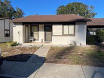 Quaint one-story home with a covered entryway and walkway at 2165 Corbin Pl # A, Palm Harbor, FL 34683