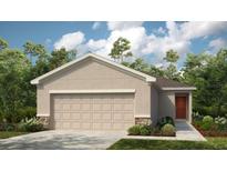 Single-story home with a two-car garage and landscaped front yard at 5803 Laurelcrest Gln, Palmetto, FL 34221