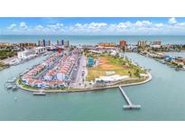 Aerial view of waterfront community with tennis courts and playground at 259 Medallion Blvd # B, Madeira Beach, FL 33708