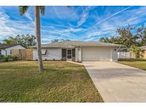 Newly renovated home with a modern exterior and landscaped lawn at 500 Randolph Rd, Venice, FL 34293