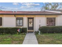 Inviting front exterior of a single-story home with a well-maintained walkway and landscaping at 11511 113Th St # 27C, Largo, FL 33778