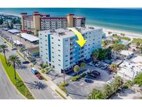 Aerial view of condo building near beach, highlighting its location and ocean proximity at 18320 Gulf Blvd # 303, Redington Shores, FL 33708