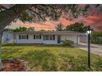 Charming single story home with a well-manicured lawn at 39093 Citadel Cir, Zephyrhills, FL 33542