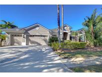 Beautiful two-story home with three-car garage and landscaped yard at 20953 Broadwater Dr, Land O Lakes, FL 34638