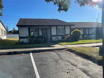 Quaint single-story home with a welcoming front entrance and landscaped yard at 2280 Bancroft S Cir # A, Palm Harbor, FL 34683