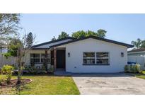 Updated bungalow with modern exterior and landscaped yard at 4511 Helena Ne St, St Petersburg, FL 33703