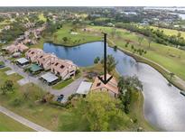 Aerial view of condo community, showcasing property location and golf course views at 1328 Pelican Creek Xing # D, St Petersburg, FL 33707