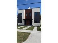 Modern two-story duplex featuring a landscaped front yard and contemporary design at 1412 S Moody Ave # A, Tampa, FL 33629