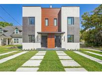 Modern townhome with sleek architectural design, professional landscaping, and inviting curb appeal at 1412 S Moody Ave # A, Tampa, FL 33629