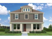 Two-story Craftsman home with gray siding, a covered porch, and a neatly landscaped yard at 432 43Rd Ne Ave, St Petersburg, FL 33703