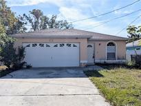 One-story house with attached garage and front yard at 2060 6Th St, Sarasota, FL 34237